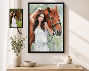 A framed custom portrait print of a woman in a white dress with a brown horse, displayed on a wall above a wooden console table with decorative vases and books. A smaller inset photo of the original reference image appears in the upper left with an arrow pointing to the artwork.
