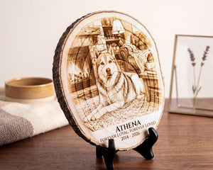 A round wooden slice plaque with a custom engraved portrait of a dog and the text 'ATHENA FOREVER LOYAL. FOREVER LOVED.