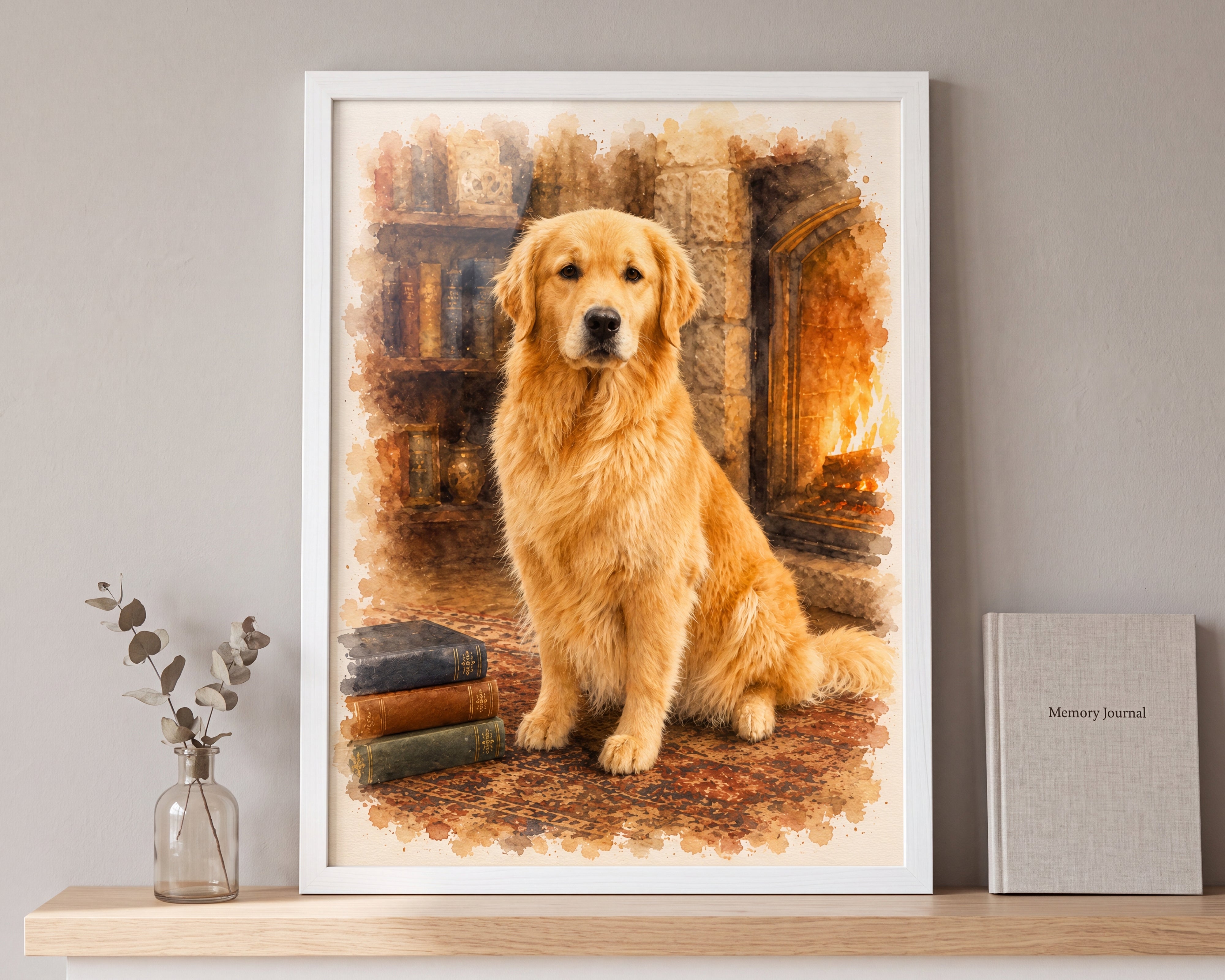 A framed watercolor-style portrait print of a golden retriever sitting in a warm indoor setting, displayed on a wooden shelf against a light gray wall with a small vase and a gray journal nearby.