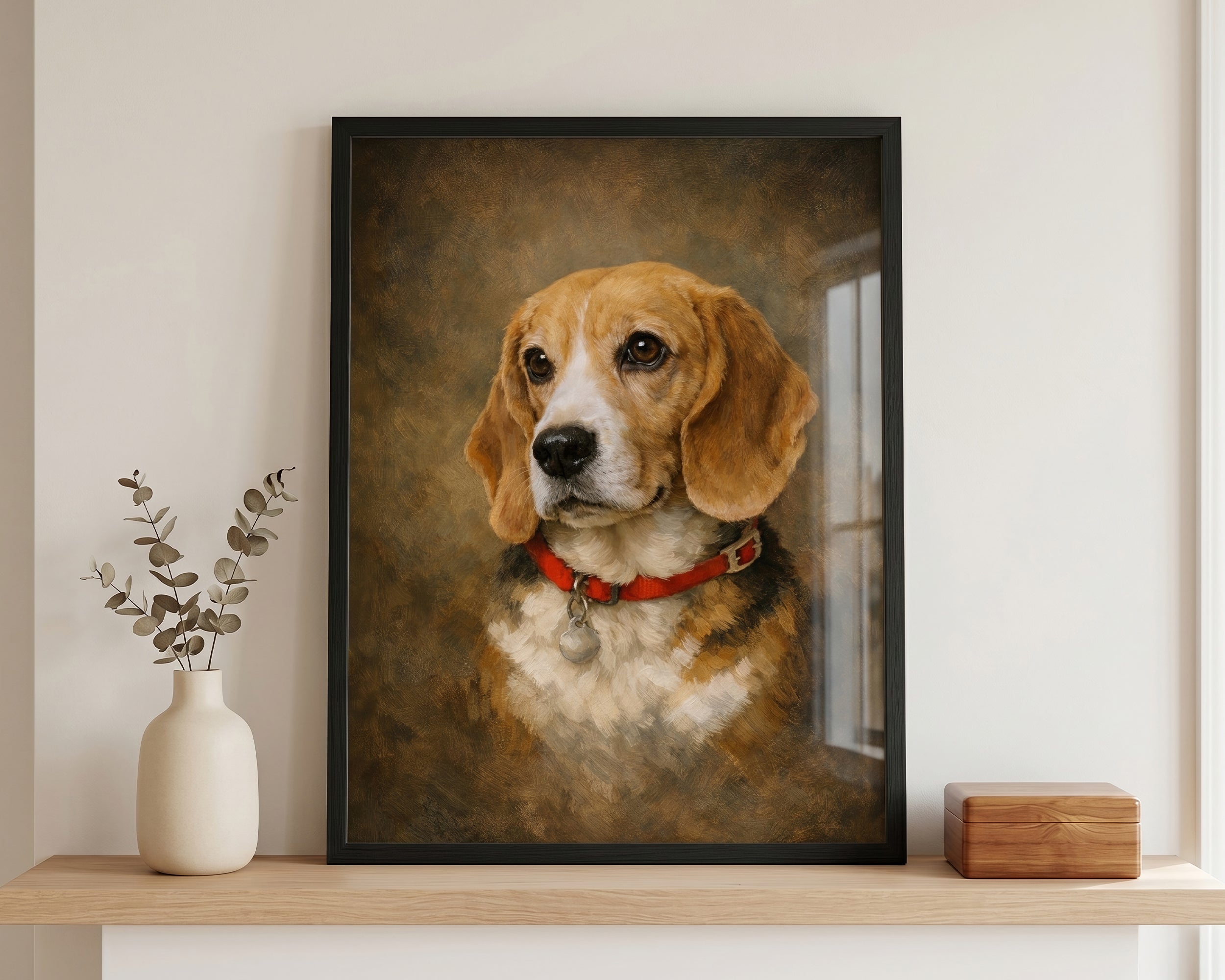 A framed custom pet portrait of a beagle on a wooden shelf, flanked by a white vase with dried leaves on the left and a small wooden box on the right.