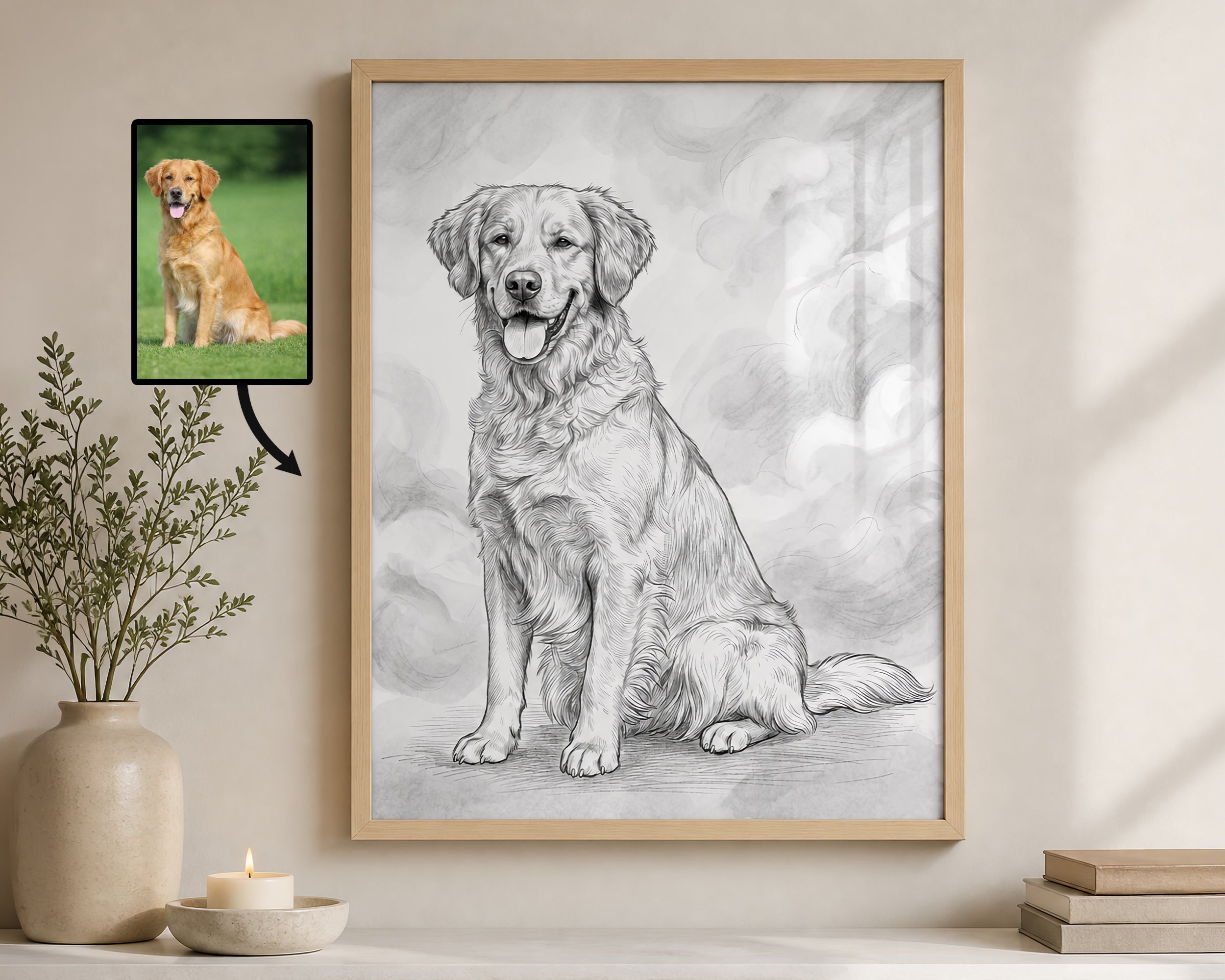 A framed custom pet portrait showing a detailed black and white pencil sketch of a golden retriever, displayed on a wall next to a small photo of the actual golden retriever and decorative home decor.