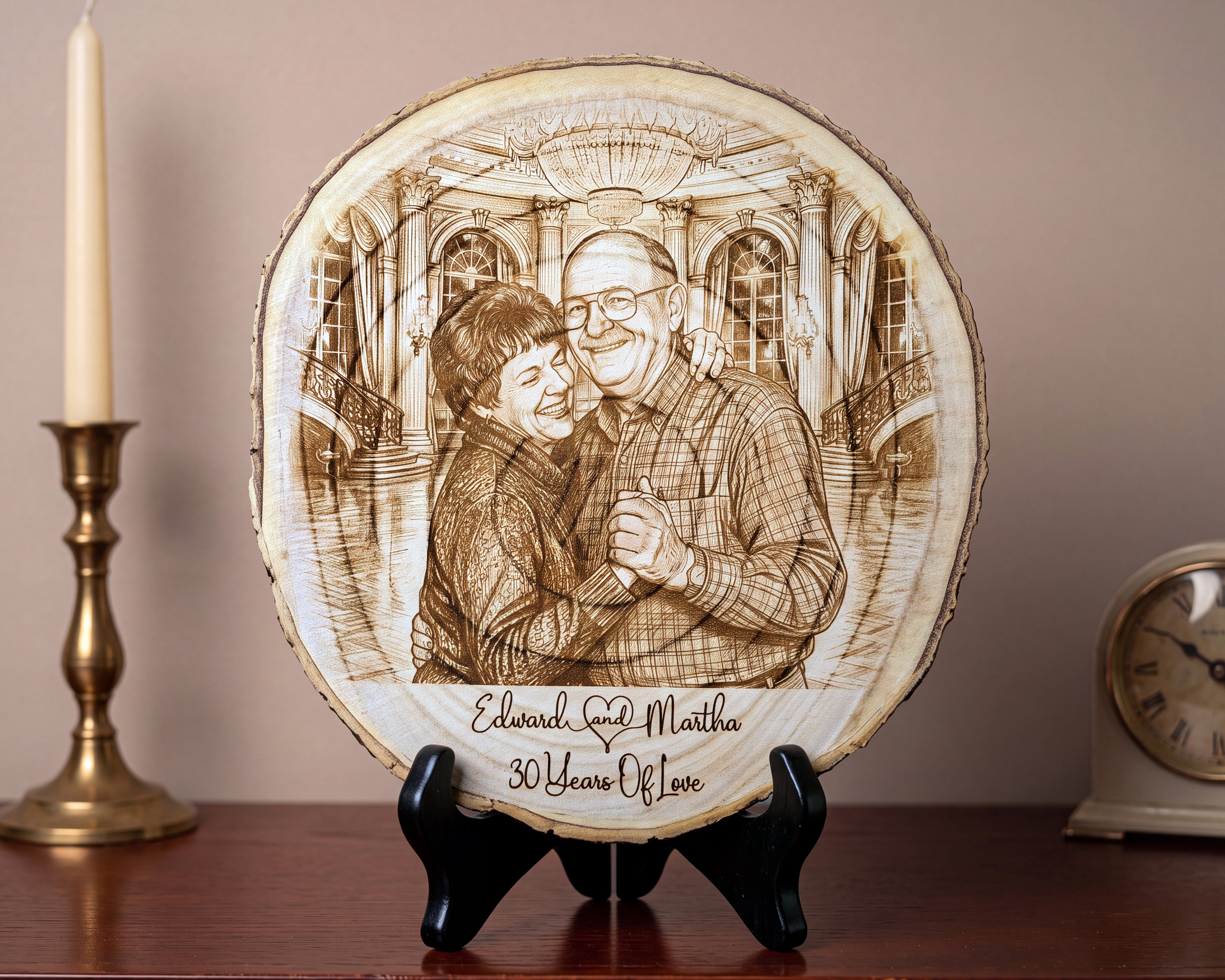 A round wood slice plaque with a custom engraved portrait of a couple and the text 'Edward & Martha 30 Years Of Love', displayed on a black stand on a wooden surface with a candle and clock in the background.