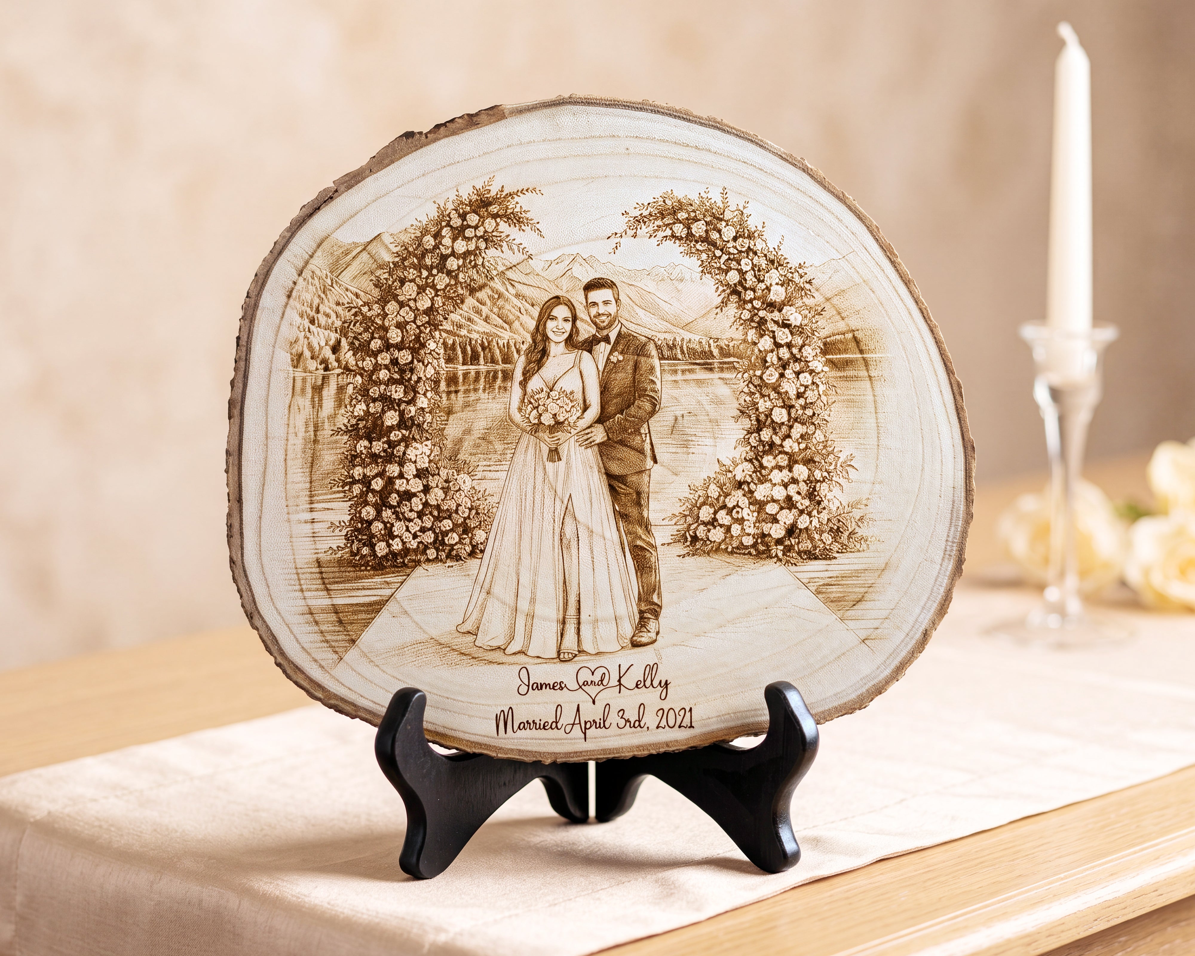 A personalized wooden slab plaque featuring a laser-engraved wedding portrait of a couple under floral arches, displayed on a black stand on a table runner with a candle in the background.