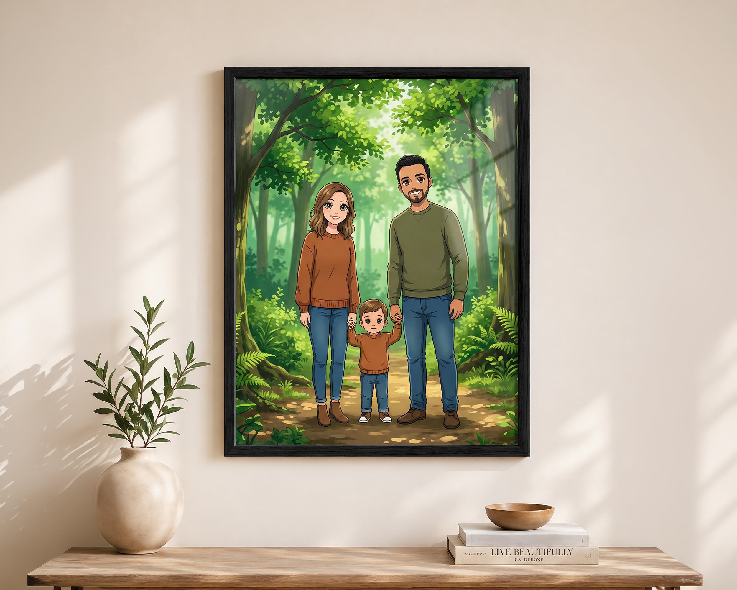 A framed custom family portrait print hanging on a beige wall above a wooden console table. The print features a cartoon-style illustration of a family of three standing in a lush green forest.